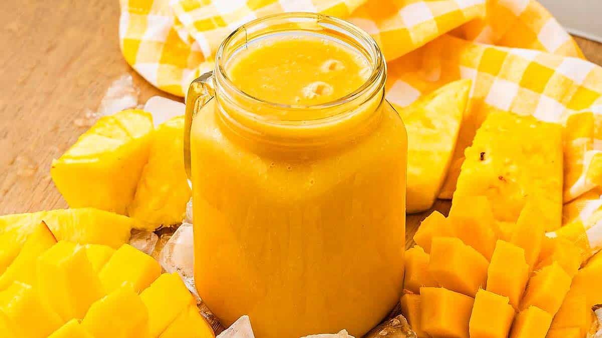 Mango jamba juice in a mason jar.