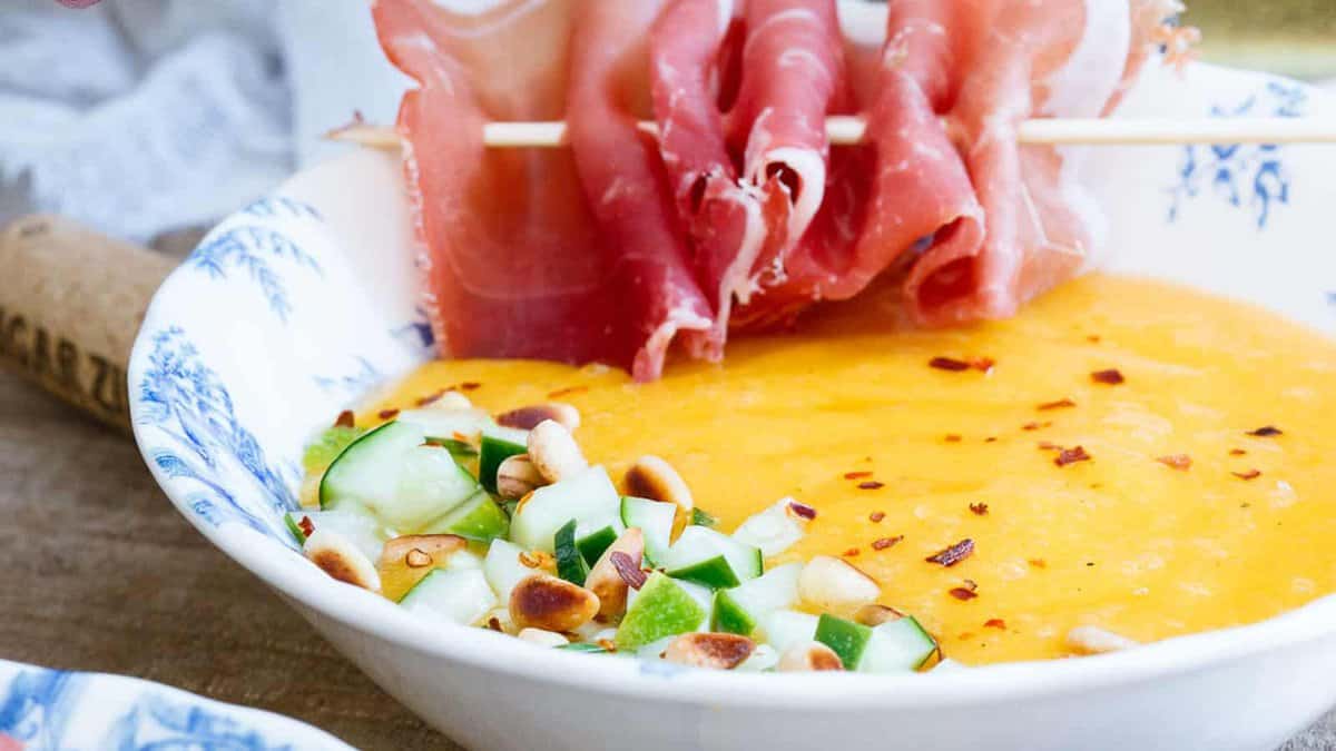 Bowl full of mango melon soup.