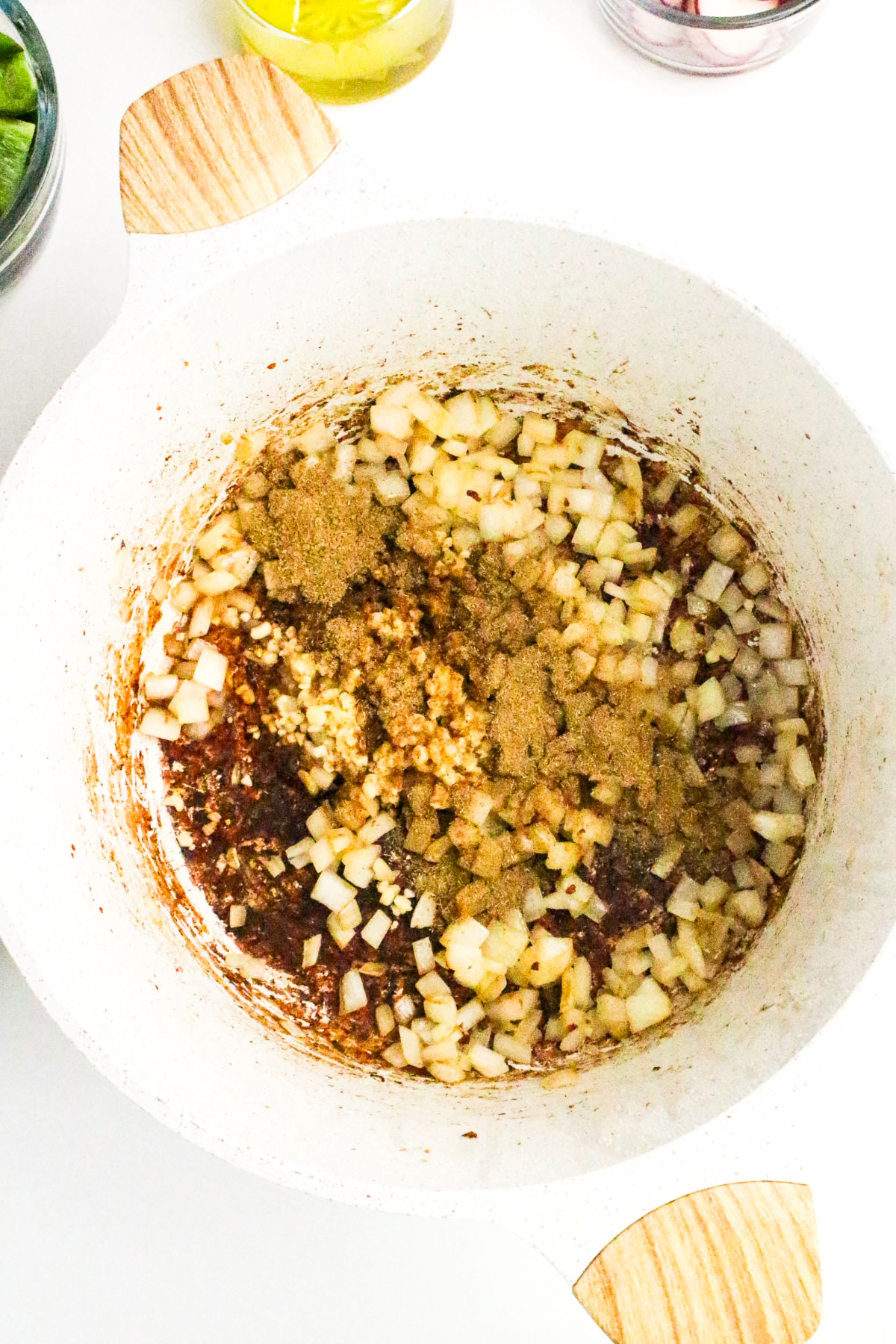 Browned pork with diced onion and spices.