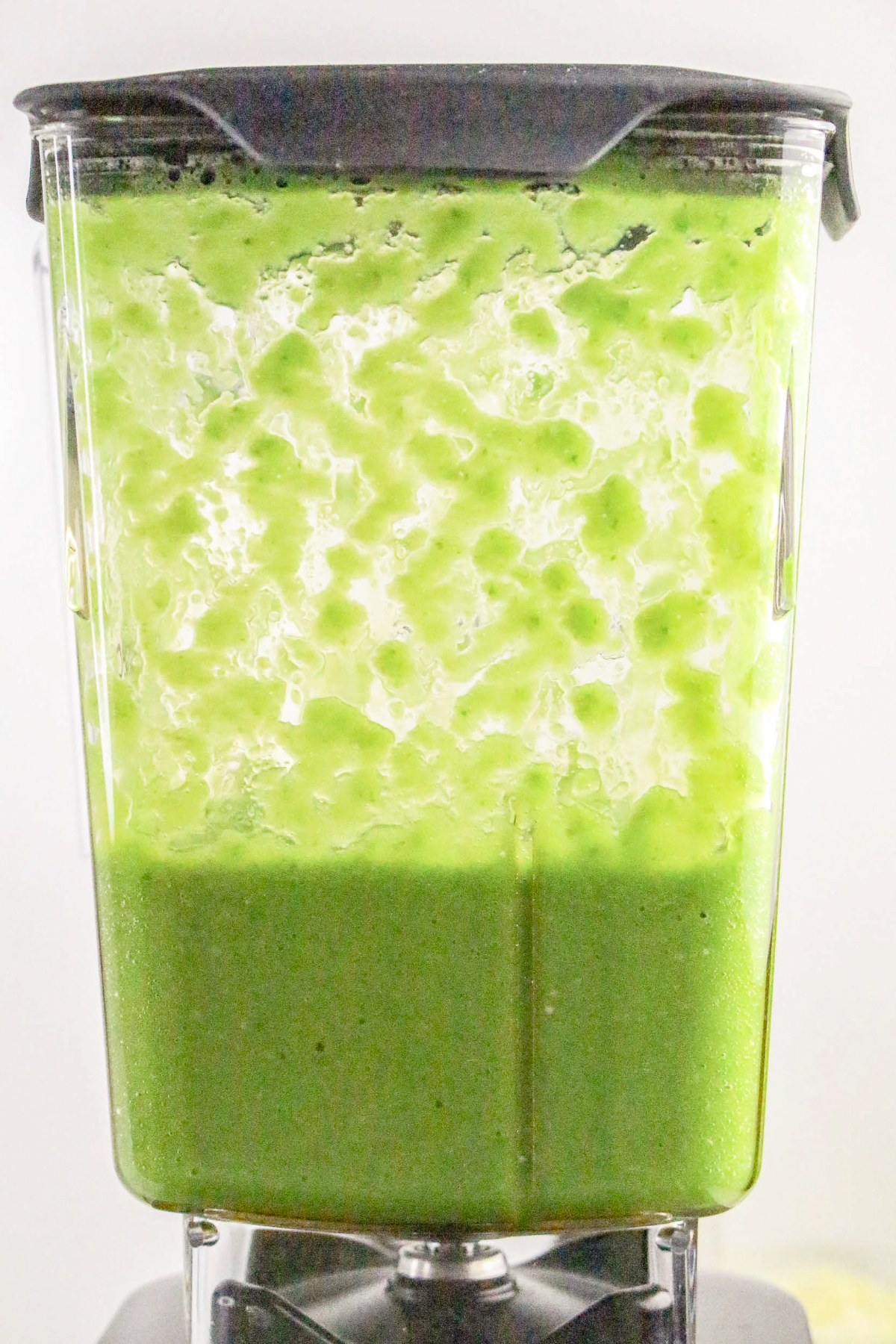 Blended tomatillo green sauce in a blender.