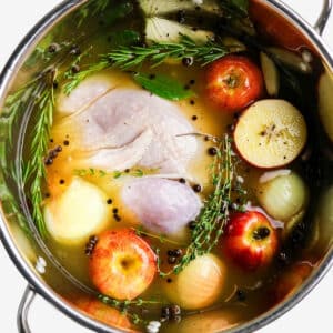 Top view of stockpot of brining a turkey with apple cider.