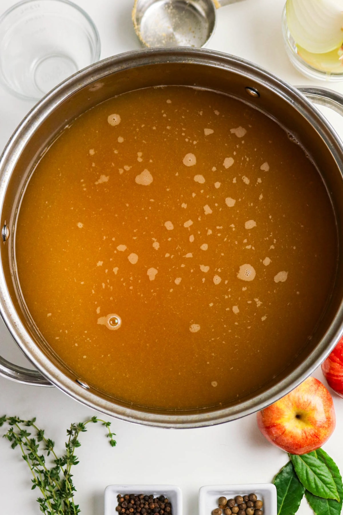 apple cider in a stock pot simmering before adding turkey to brine.