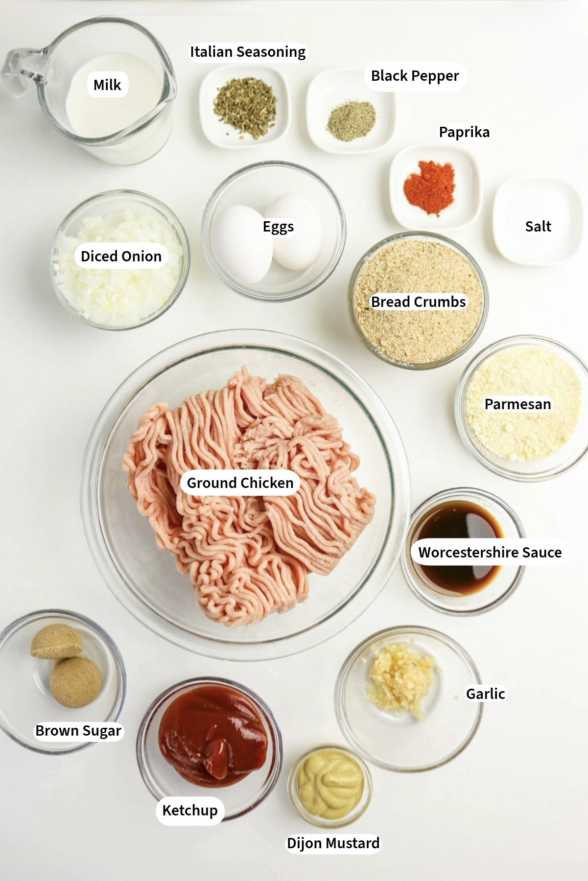 Ingredients in small glass bowls to make chicken meatloaf