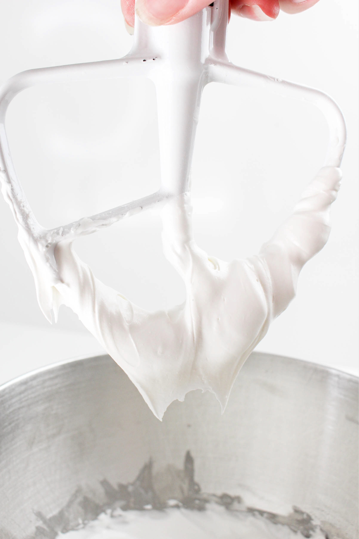 Icing on a stand mixer paddle.