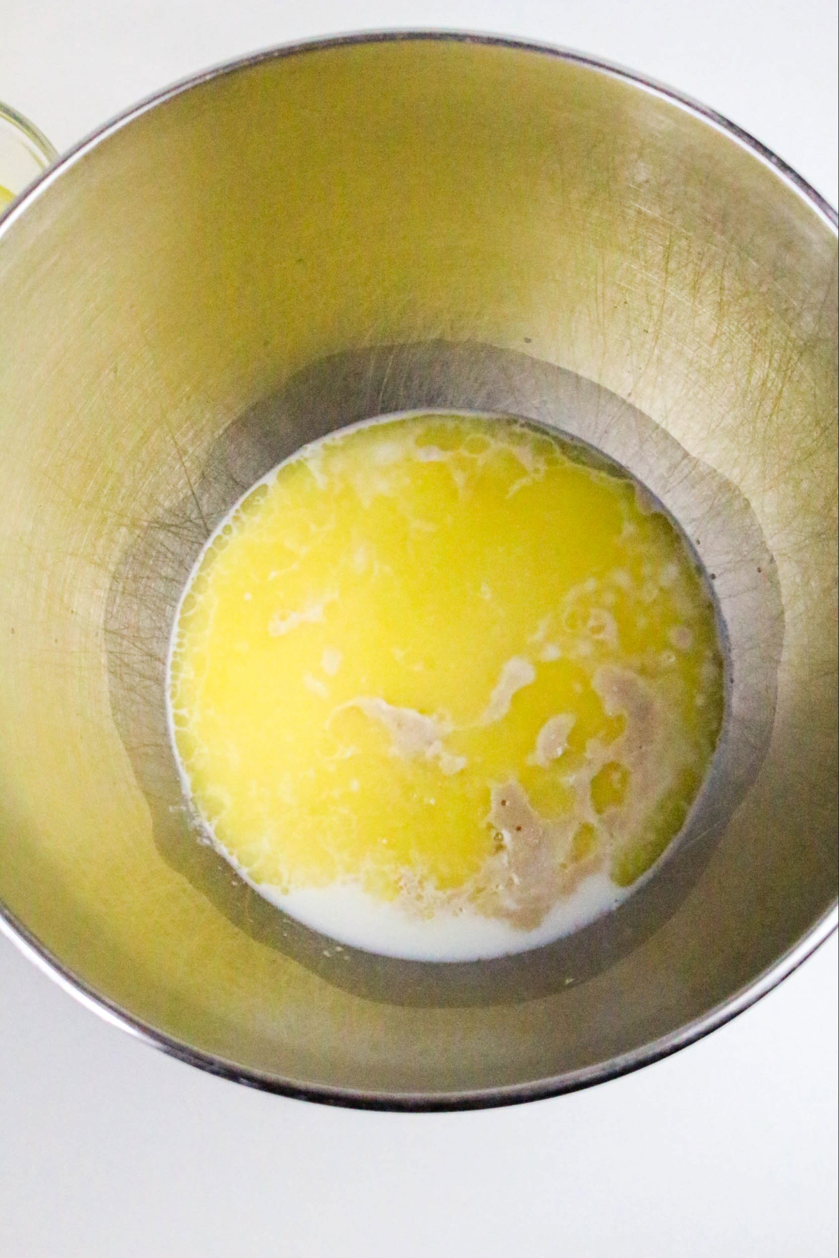 yeast, butter and honey in a mixing bowl.