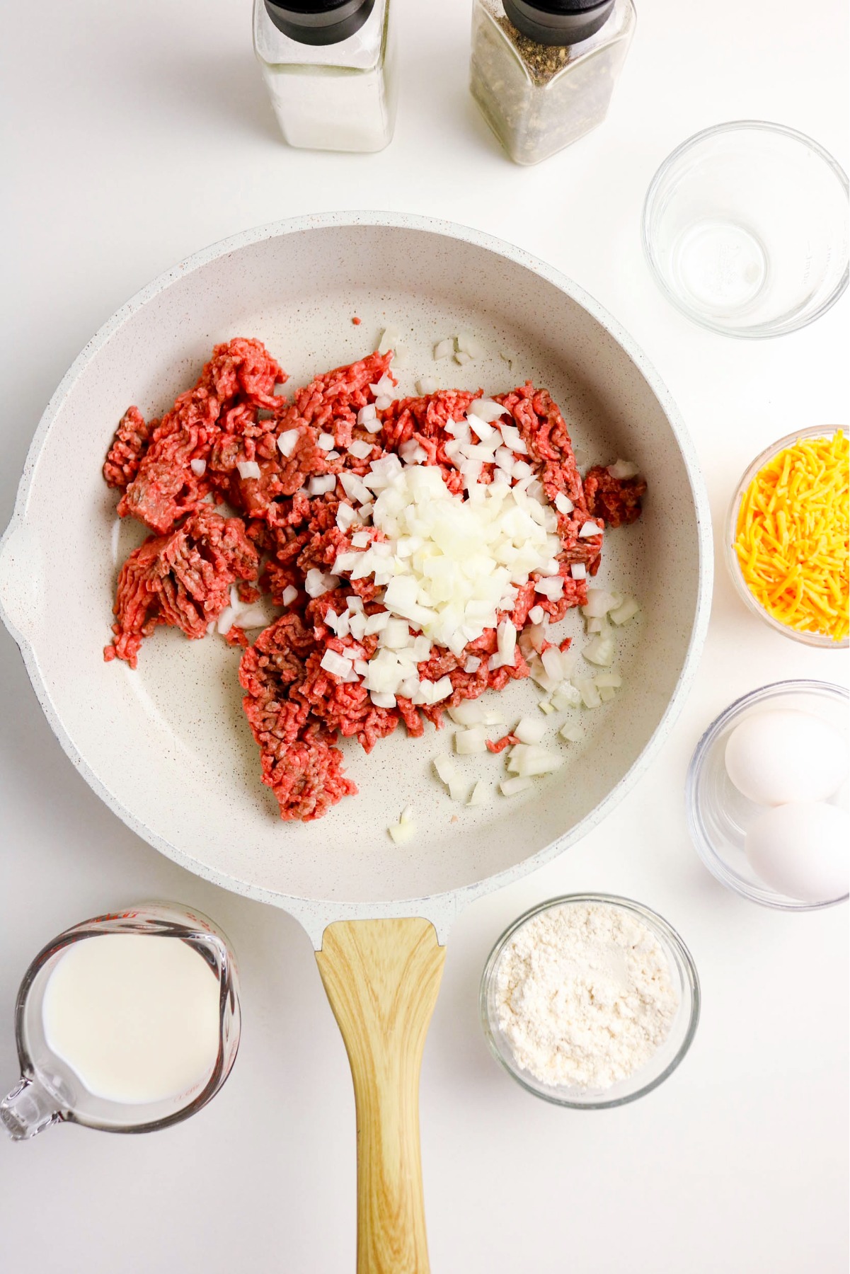 Sautéing ground beef and onion in a skillet.