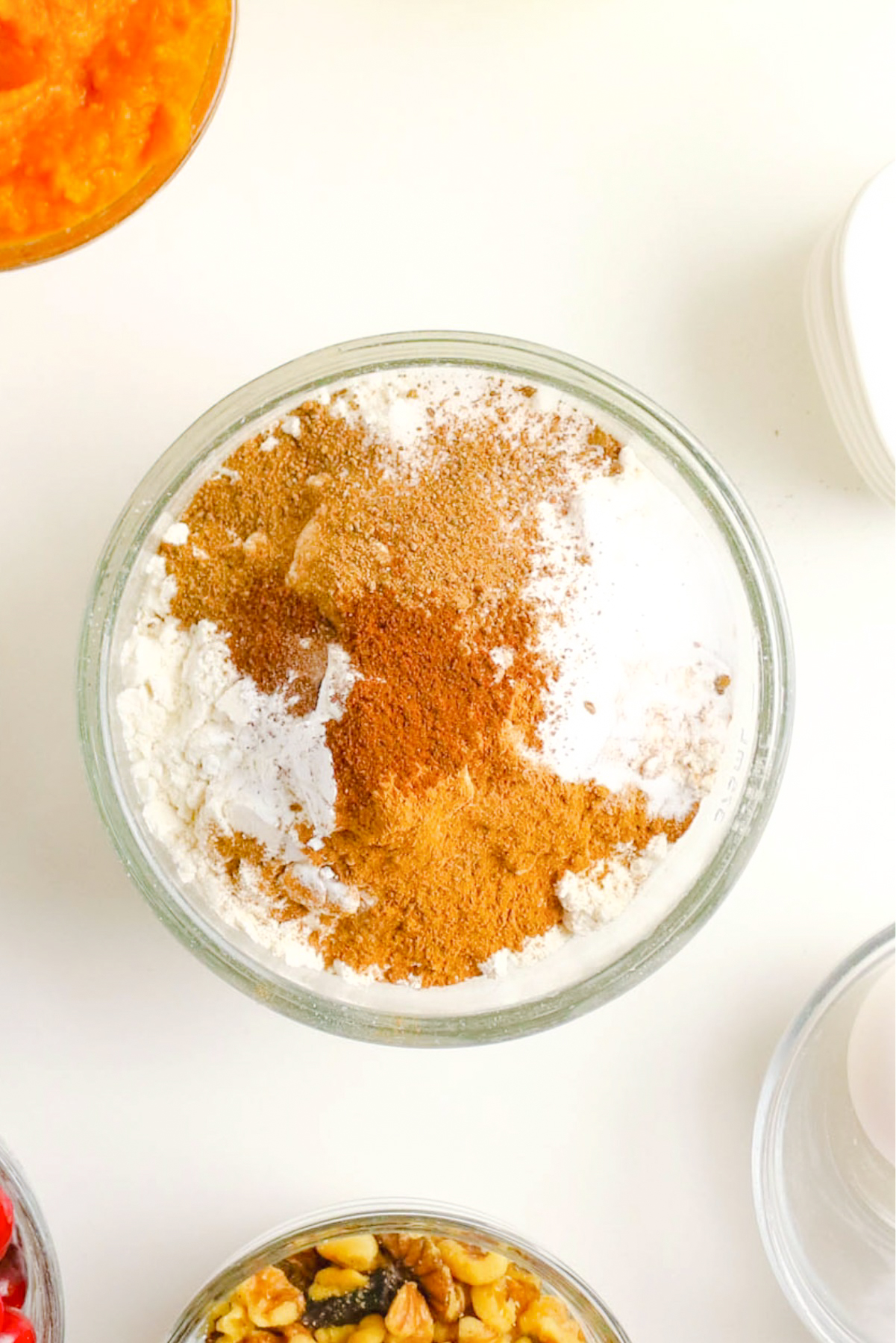 flour ingredients with spices in a clear mixing bowl.