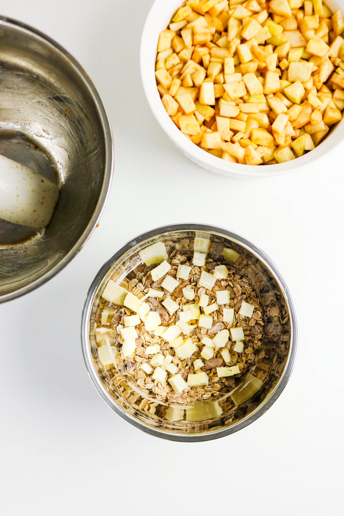 Diced butter over apple crisp topping before mixing.