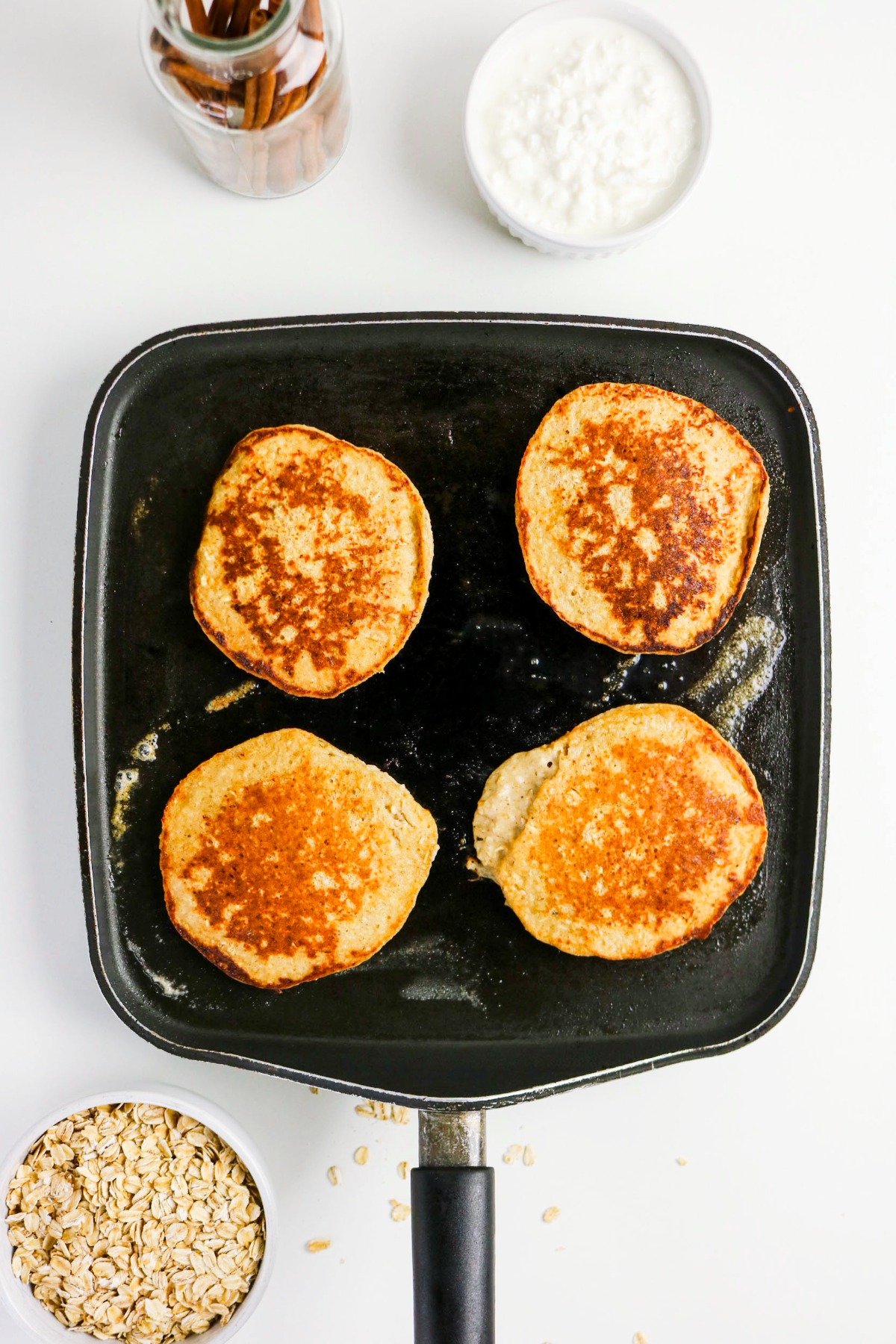 Cooked pancakes on a griddle.