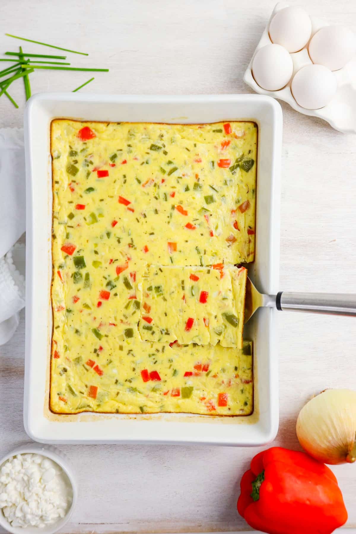 Cooked cottage cheese egg bake in a white casserole dish before serving.