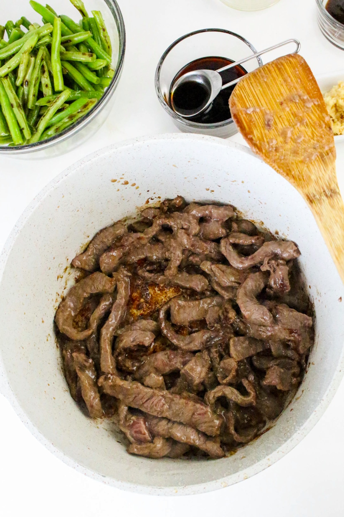 Sautéed beef in a skillet.
