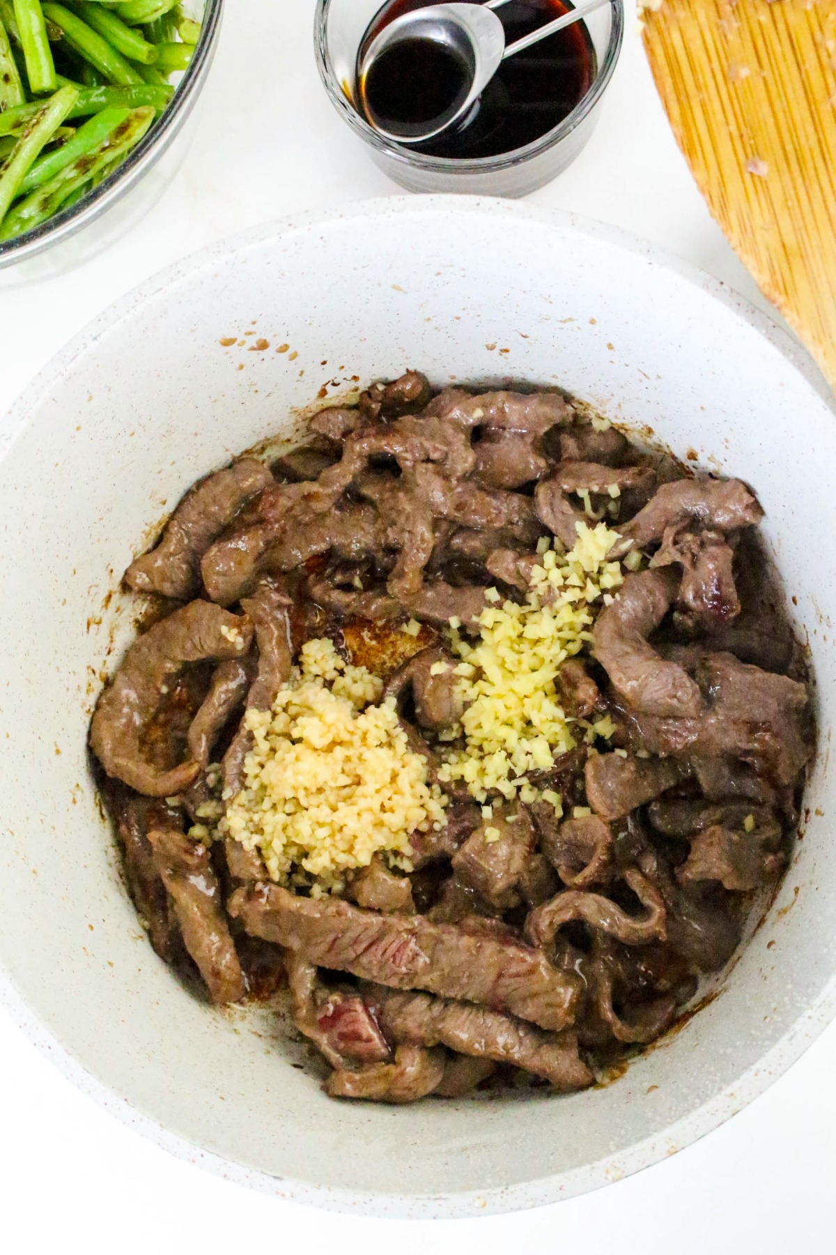 Ginger and garlic added to sautéed beef.