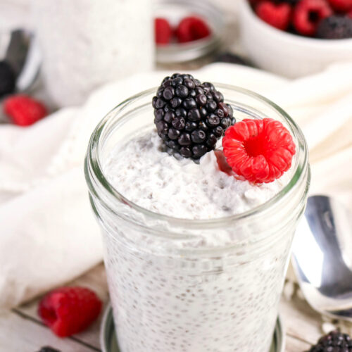 Chia pudding made with coconut milk topped with blackberry and raspberry.
