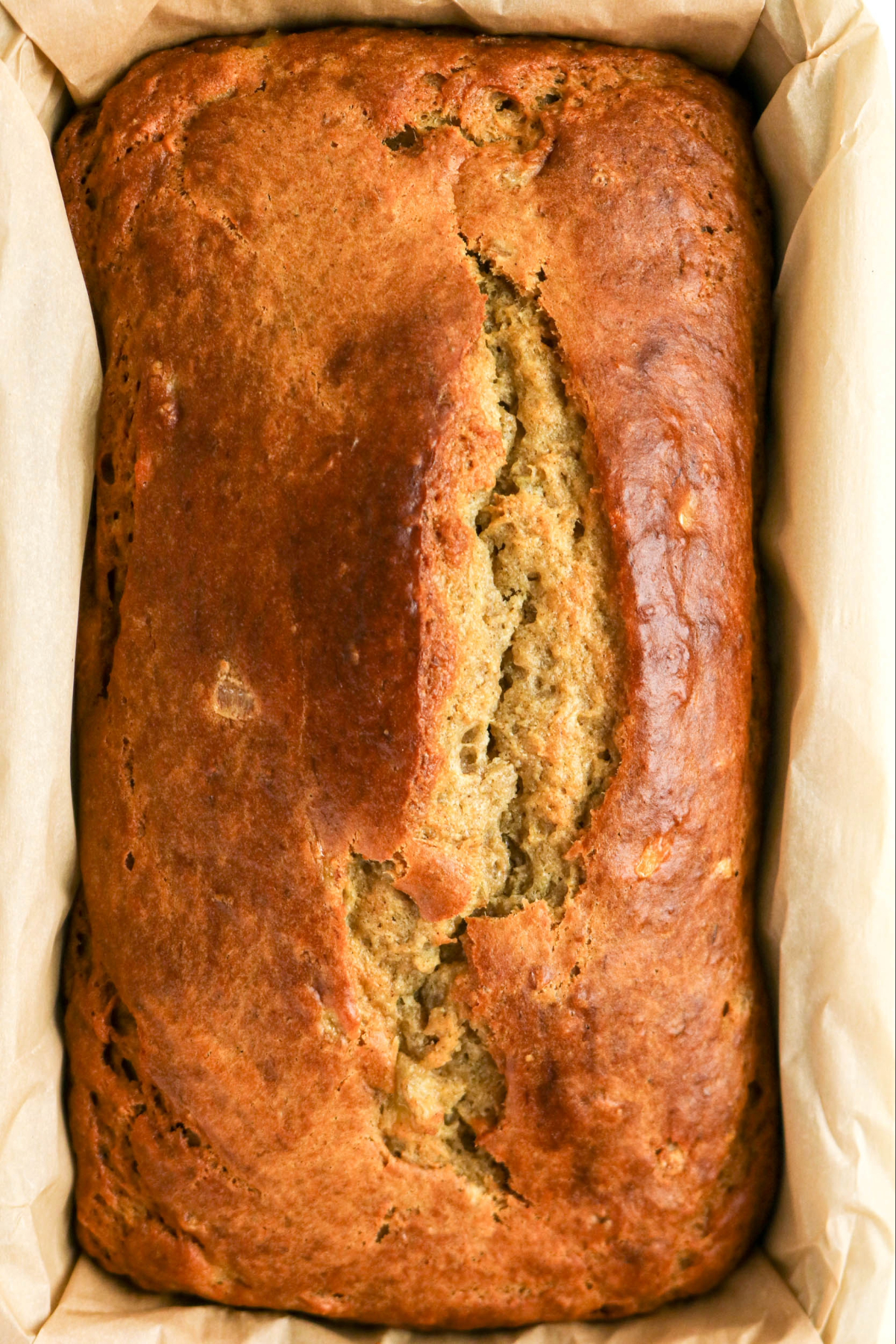 Baked banana bread in a loaf pan.
