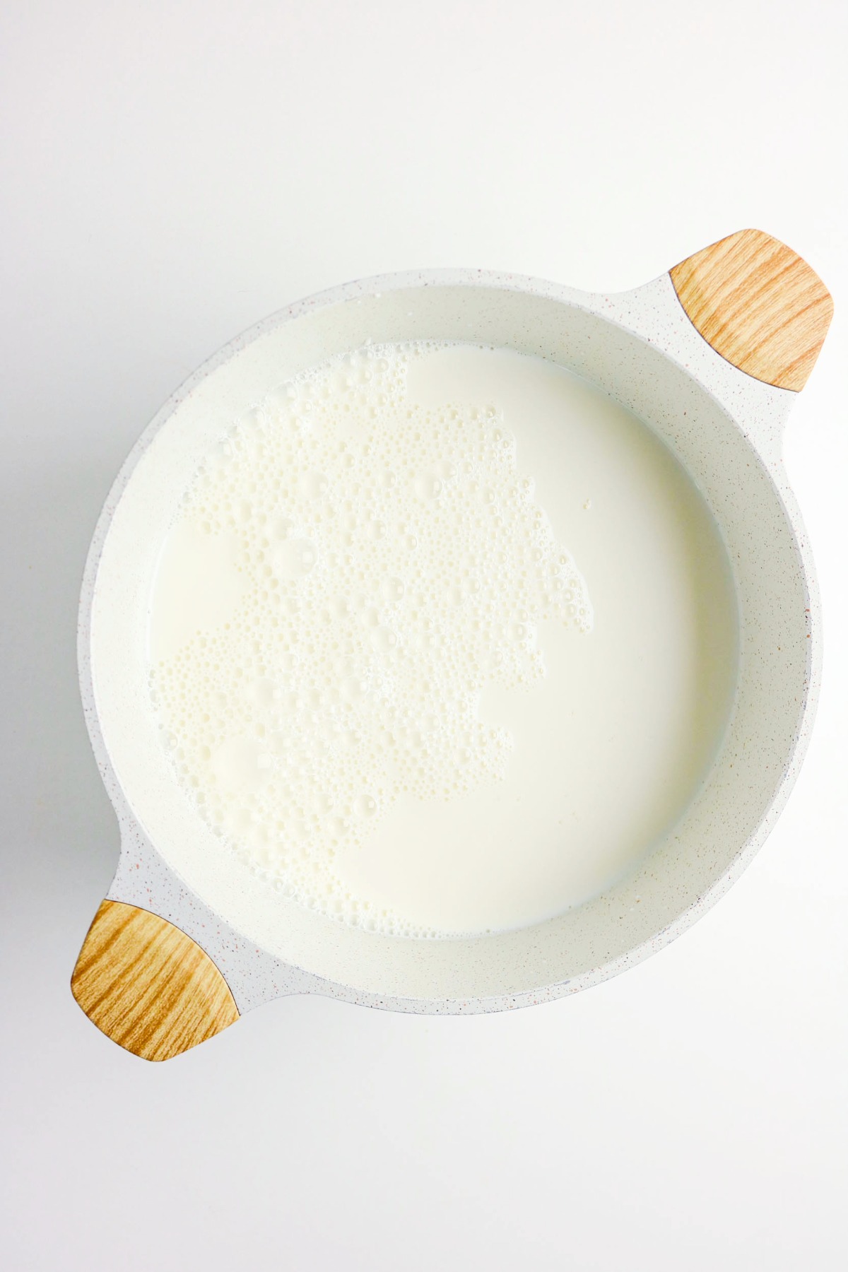 Milk in a large saucepan to cook cottage cheese.