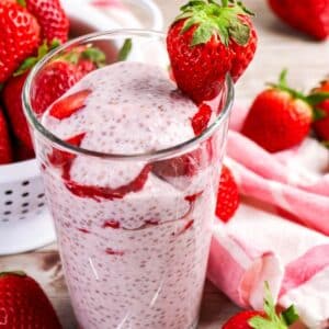 Strawberry chia pudding made with almond milk in a glass parfait.