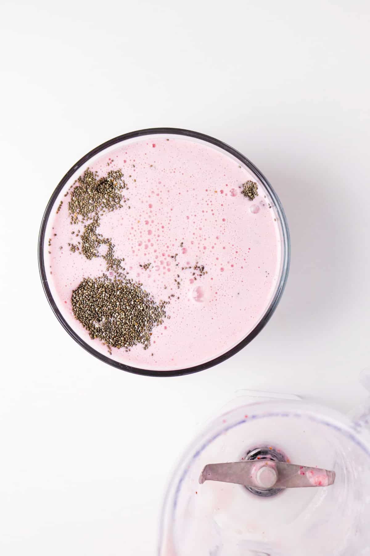 chia seeds mixed with almond milk and strawberries.