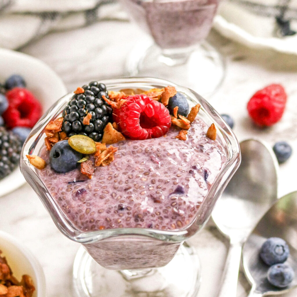 Berry chia pudding with fesh fruit and granola.