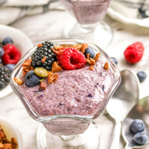 Berry chia pudding with fesh fruit and granola.