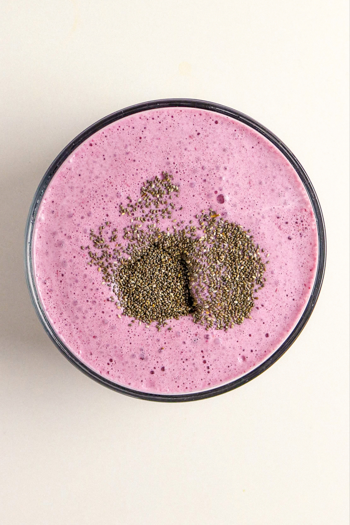 chia seeds in a berry blended mixture before combining.