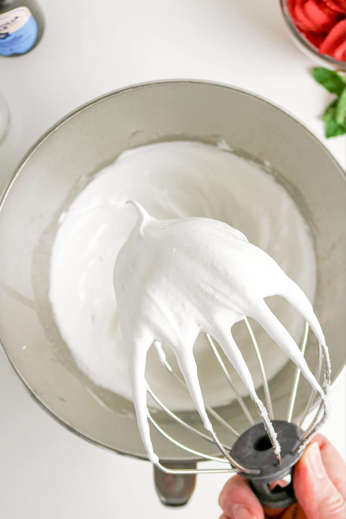 Whipped egg whites in a stand mixer.