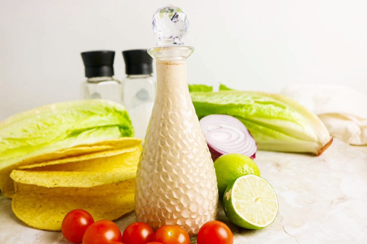 Salad dressing in a clear decanter.