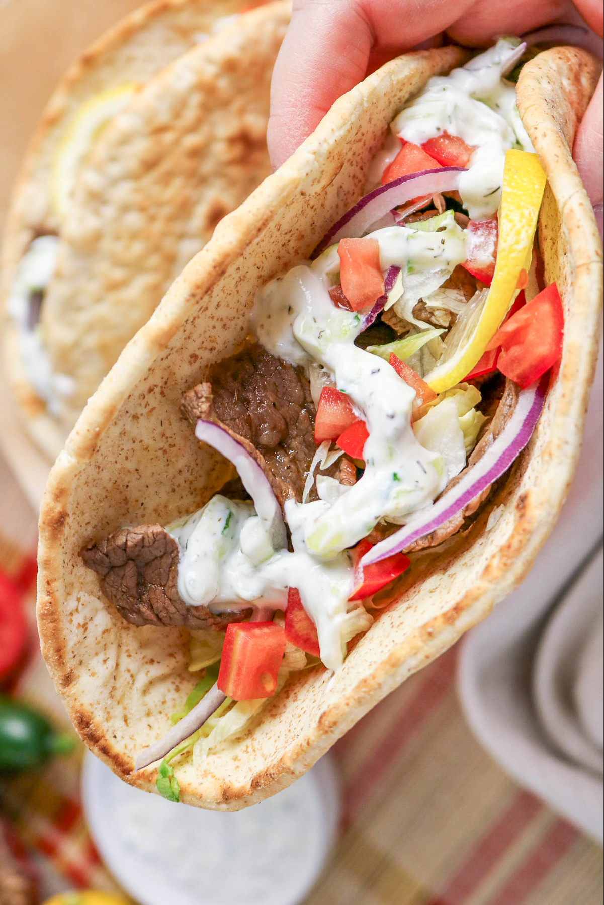 Beef gyros with tzatziki sauce.