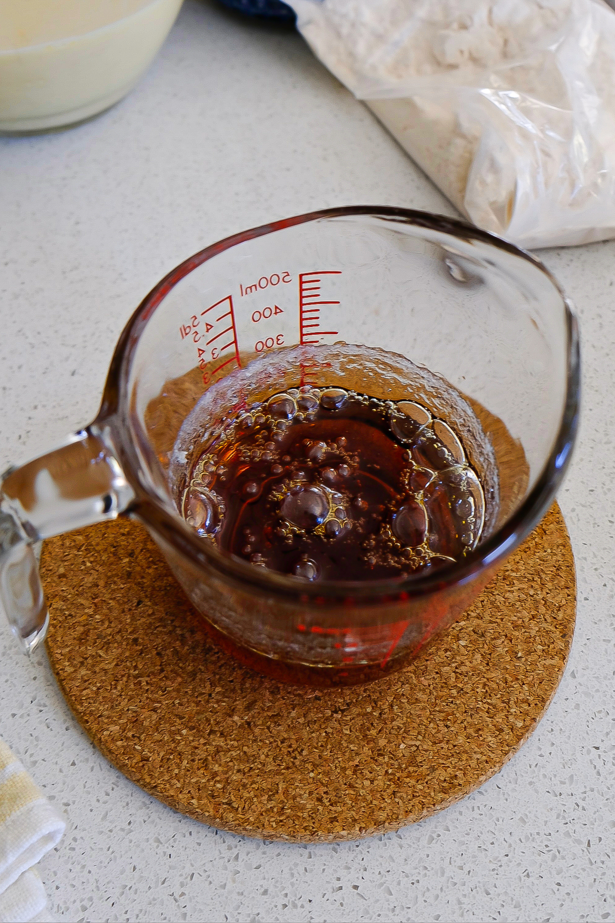 Caramel in a glass measuring cup.