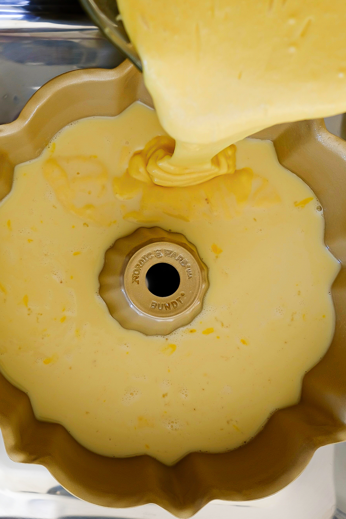Cake mix poured over flan mix before baking.