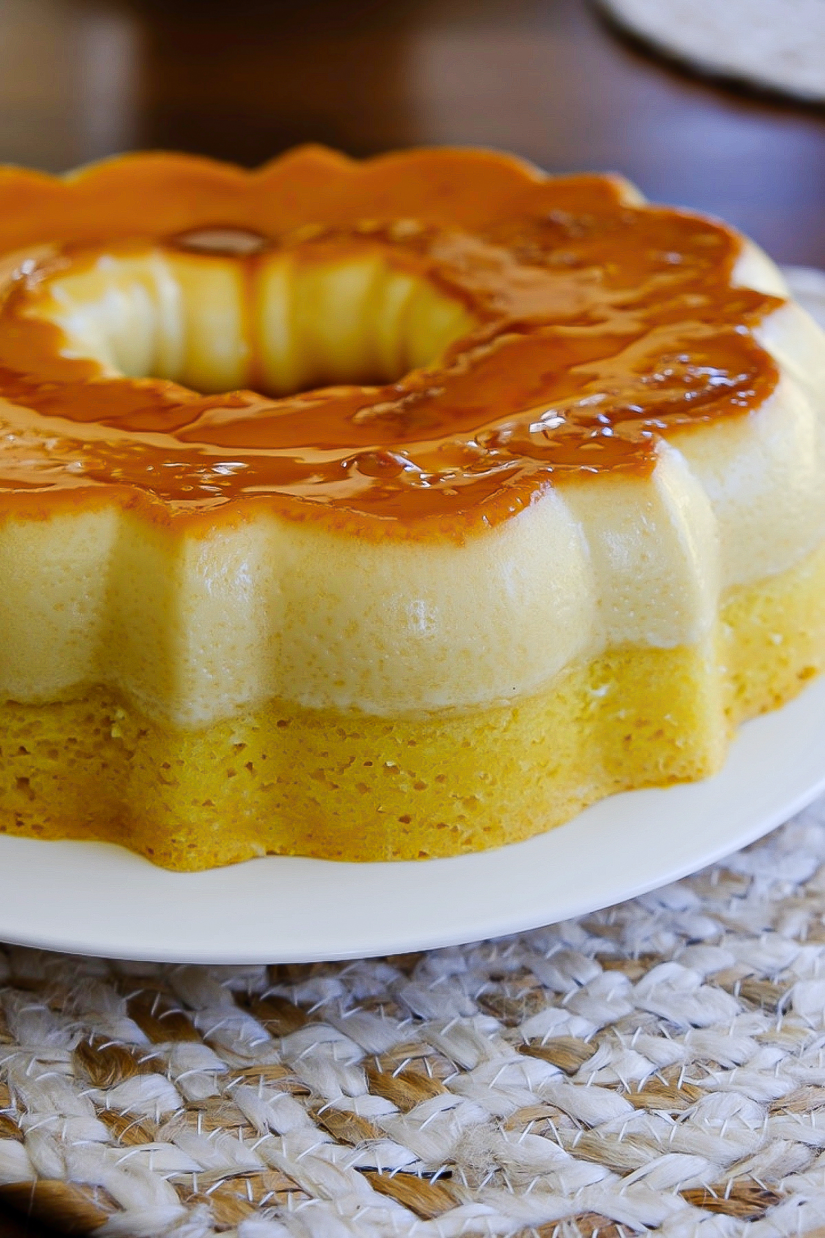 Baked flan can on a white serving plate.