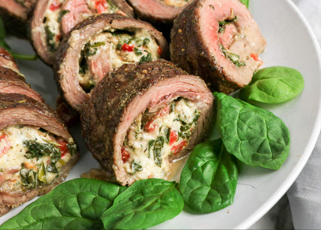 Flank steak on a serving platter.