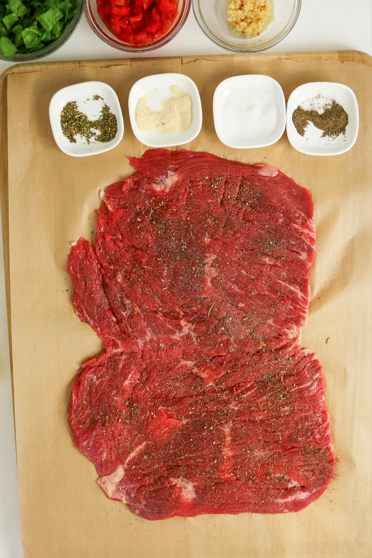 Seasoning on a slice of flank steak.