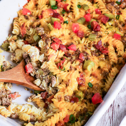 Casserole with flavors of cheeseburgers in a white casserole dish.