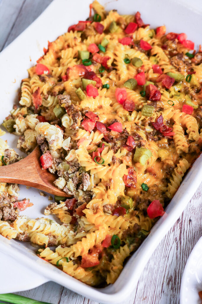 Casserole with flavors of cheeseburgers in a white casserole dish.