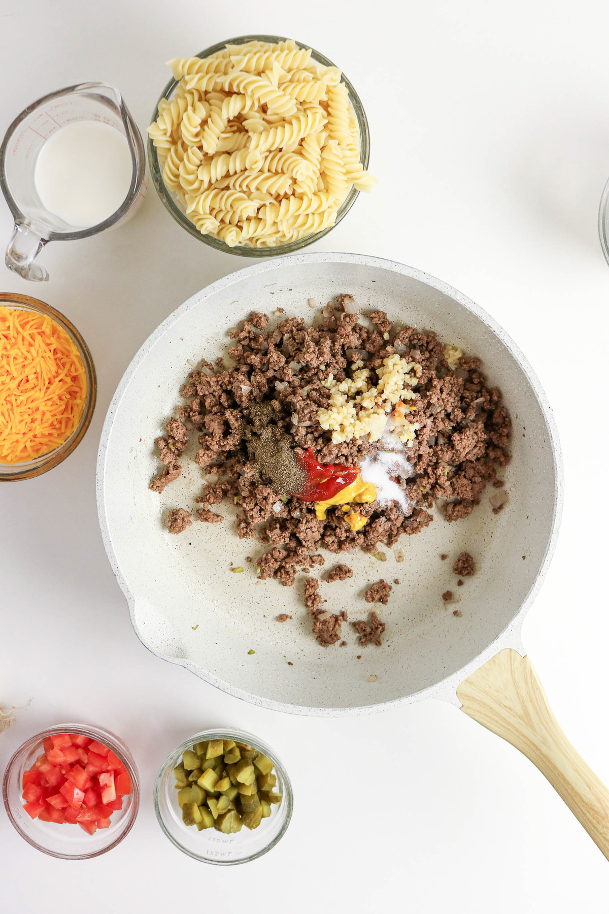 Cooked ground beef in a skillet with spices.