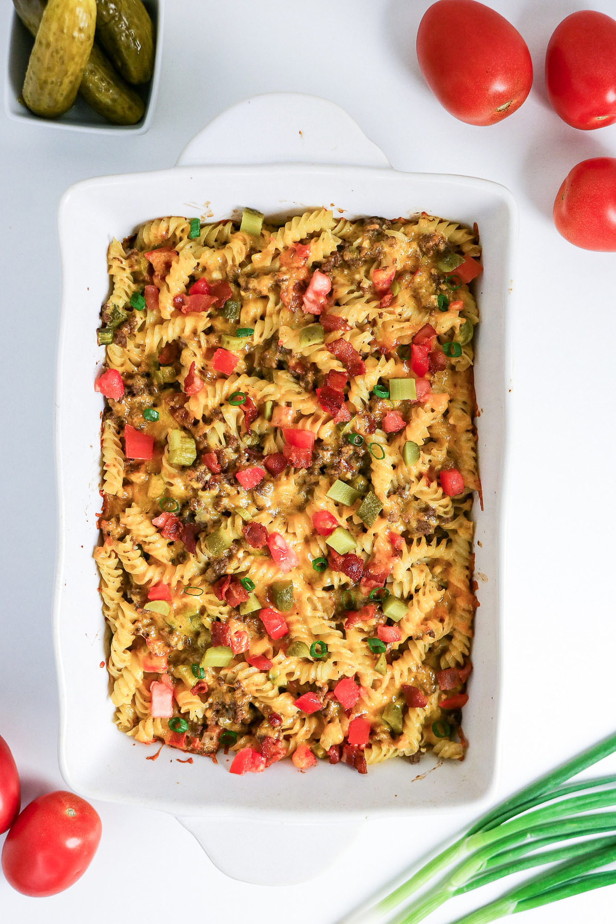 Baked bacon cheeseburger casserole with added toppings.