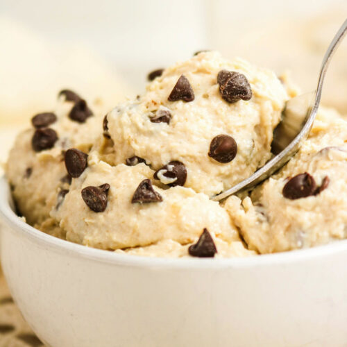A white bowl with eatable cookie dough made with cottage cheese.