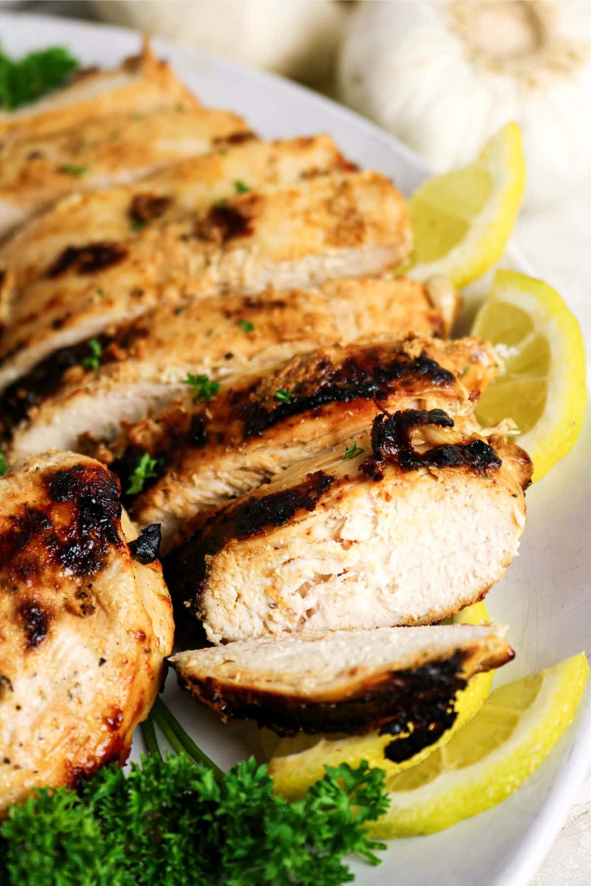 Sliced chicken breast on a platter.