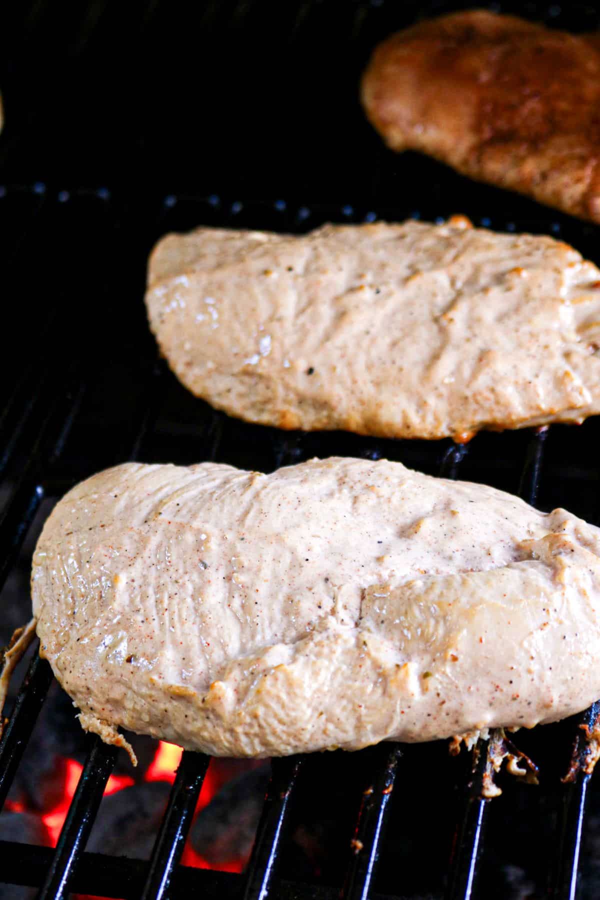 Grilling chicken breasts.