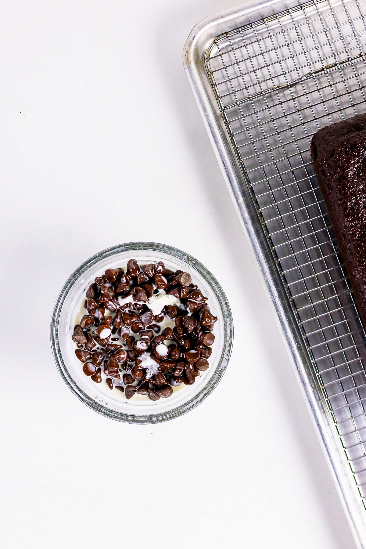 Chocolate chips in a small mixing bowl before melting to make a frosting.