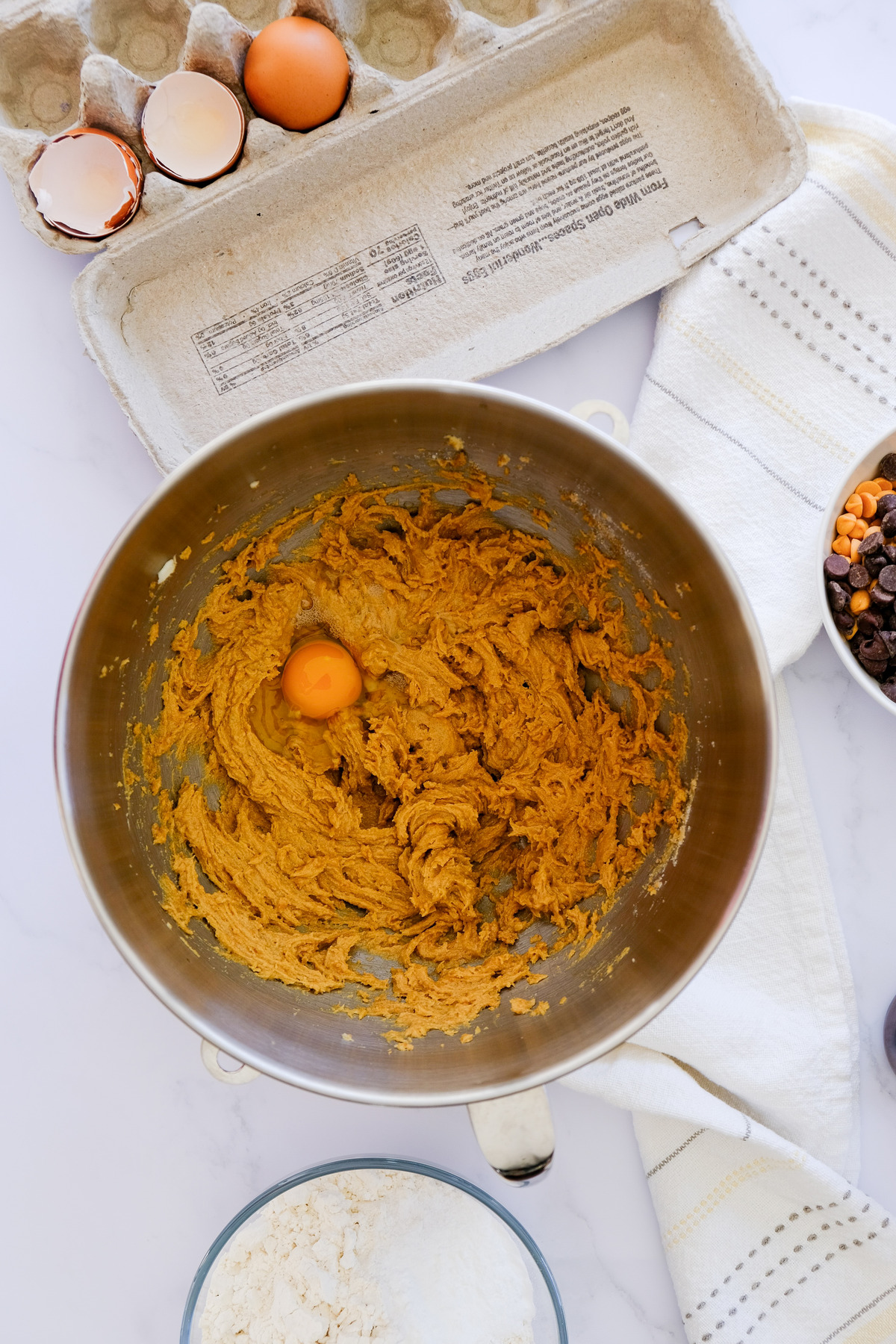Butter, peanut butter sugars and egg creamed in a mixing bowl.