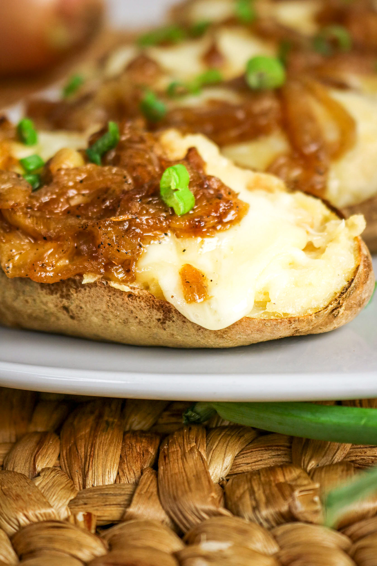 Baked potato topped with caramelized onions.