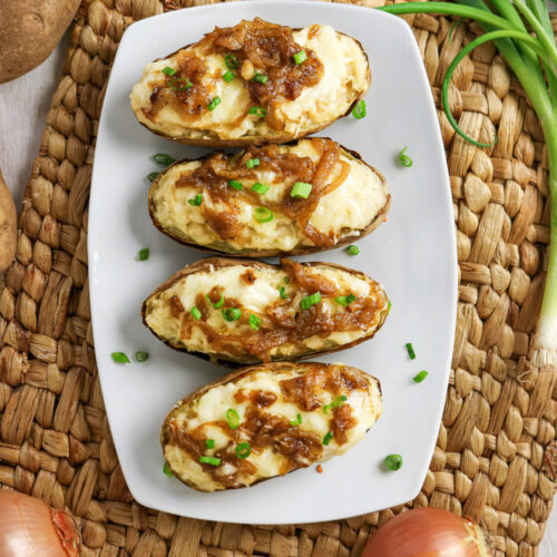 Top view of french onion twice baked potatoes on a platter ready to serve.