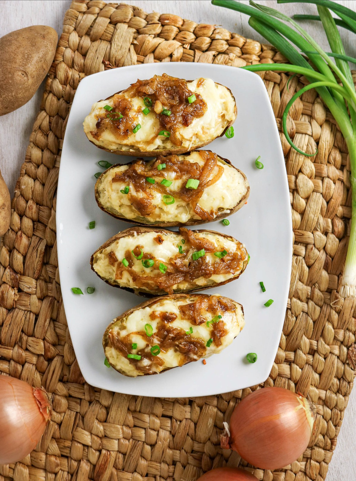 Top view of french onion twice baked potatoes on a platter ready to serve.