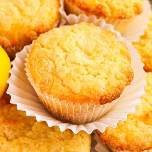 A plate piled with fresh baked lemon muffins.
