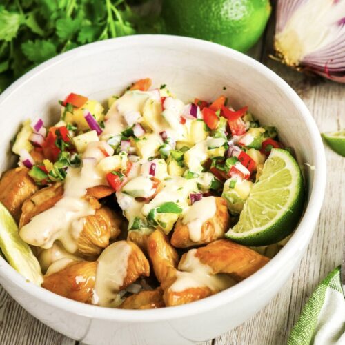 Pineapple chicken meal in a white bowl.