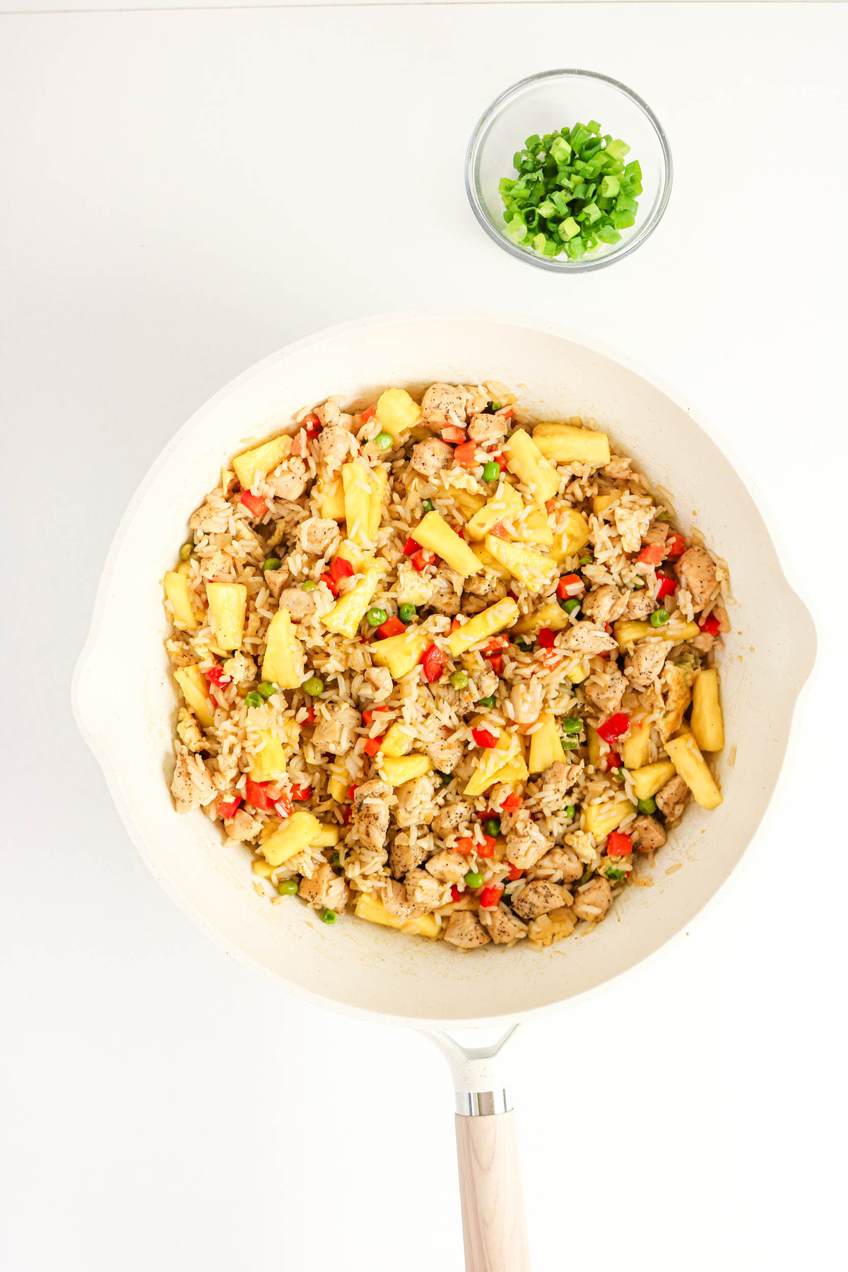 Finished pineapple and chicken fried rice in a skillet.