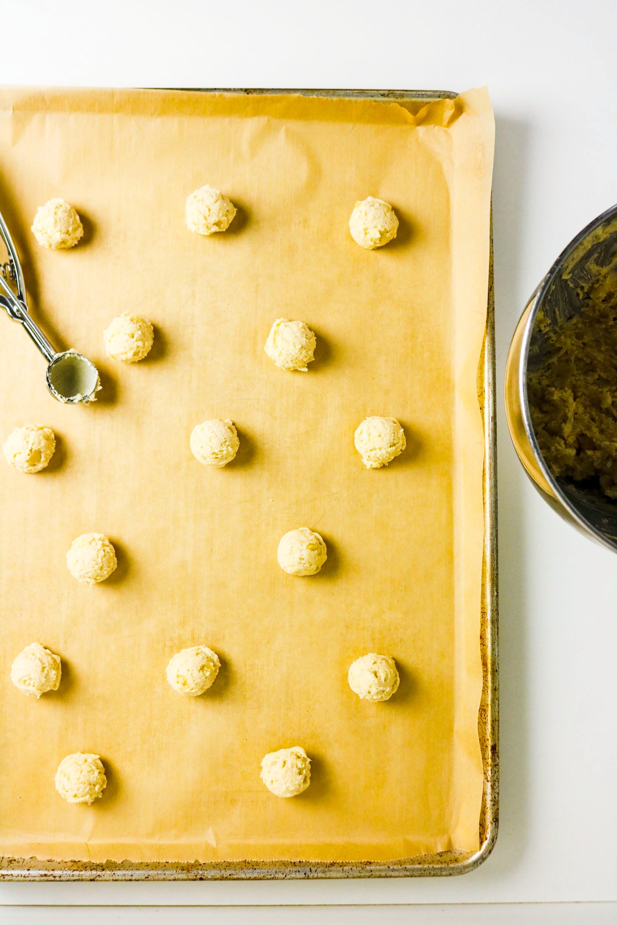 Rolled cookies on a baking sheet.
