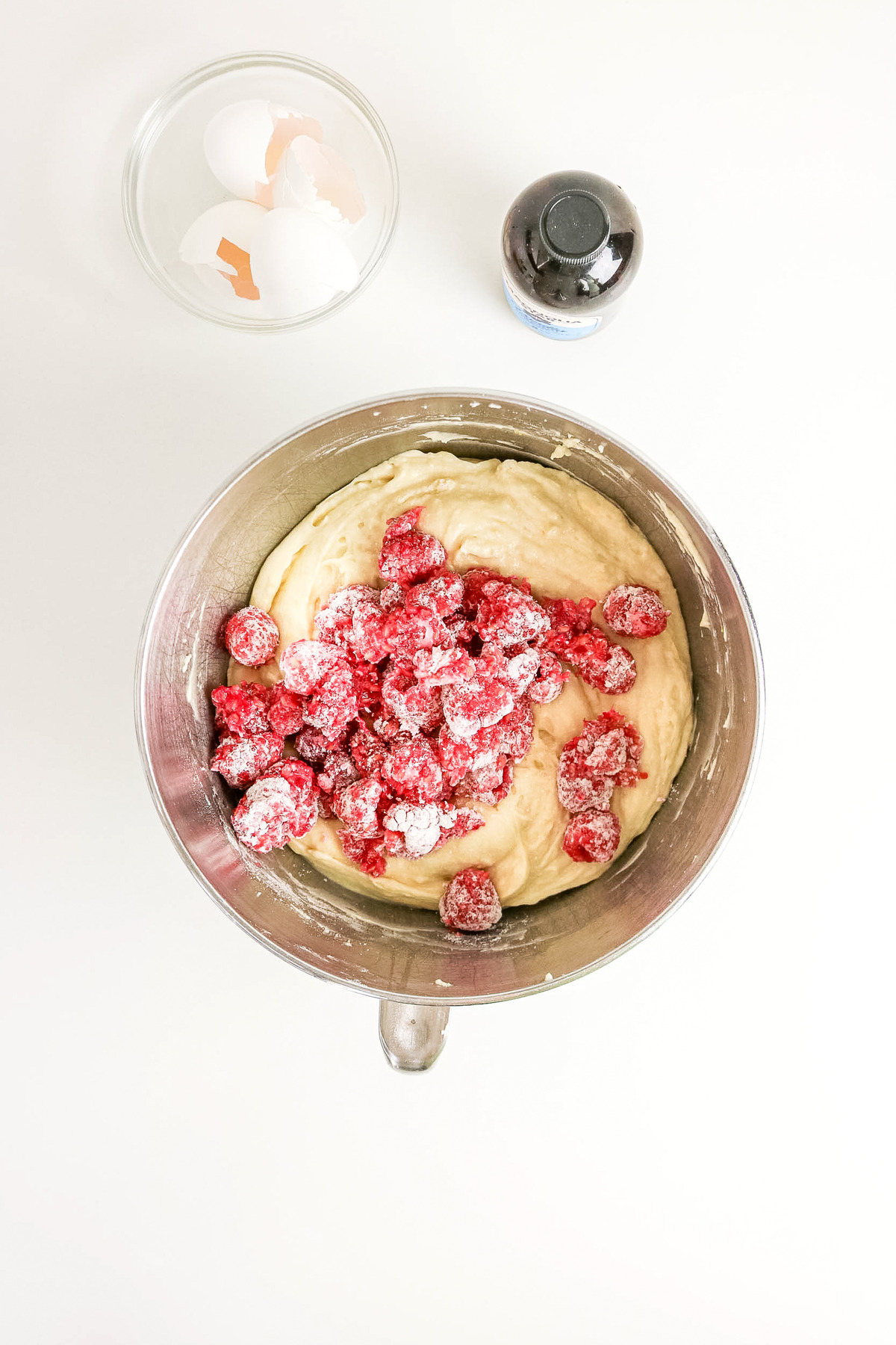 Folding the flour coated raspberries into the cake batter.