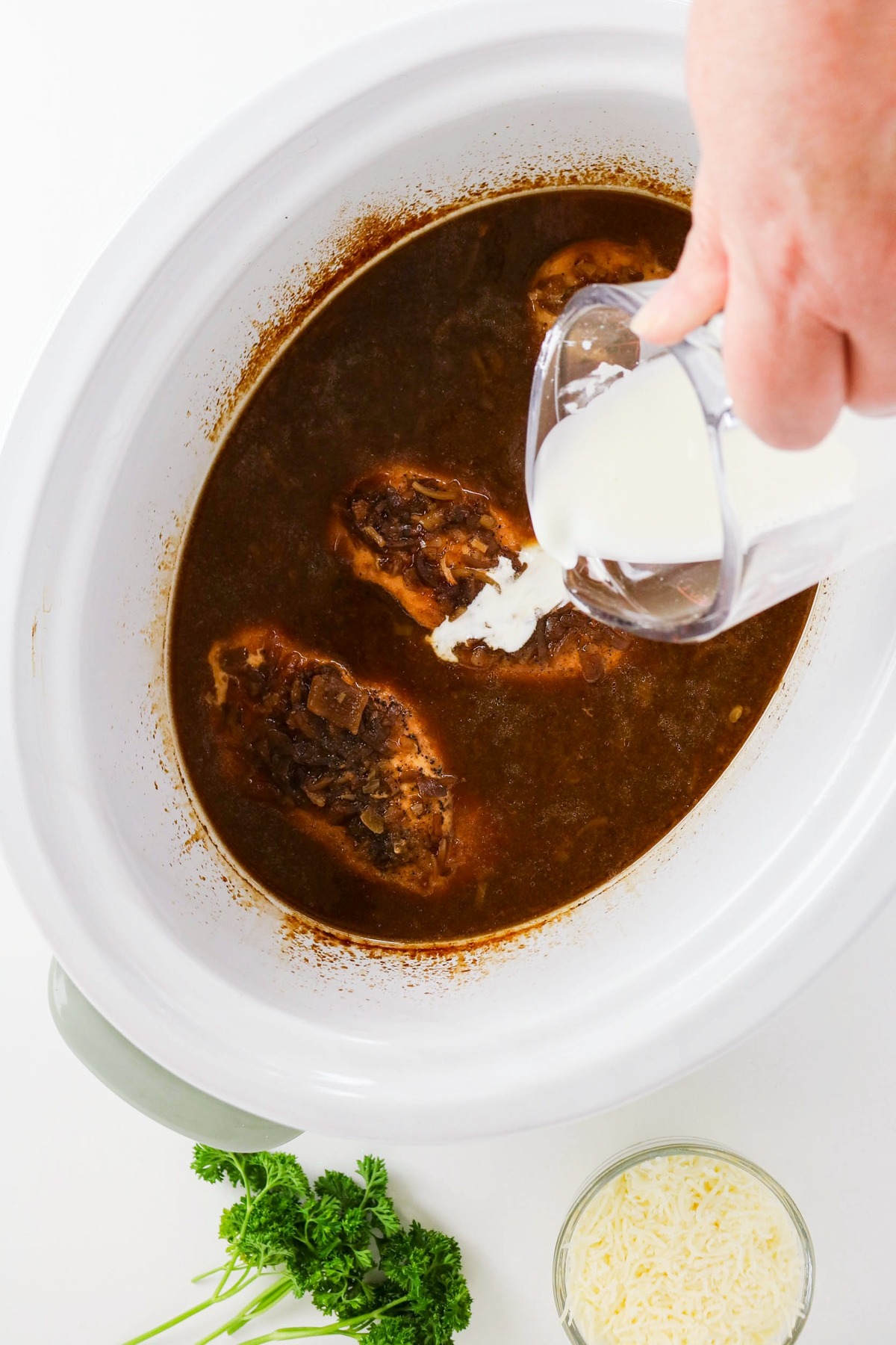 Cornstarch added to soup ingredients to thicken in a slow cooker.